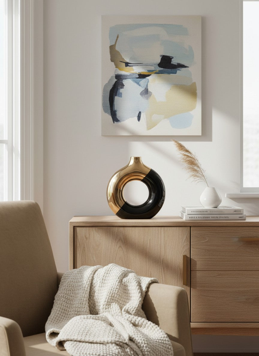 Vase rond design Ma boutique en céramique noire et dorée, finition brillante, forme ajourée.
